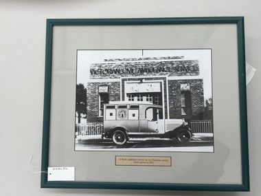 Photograph, framed, A Buick ambulance outside the new Footscray Station, which opened in 1933