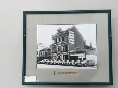 Photograph, framed, The fleet of Dodges assembled outside Ambulance Headquarters in Lonsdale Street - circa 1935