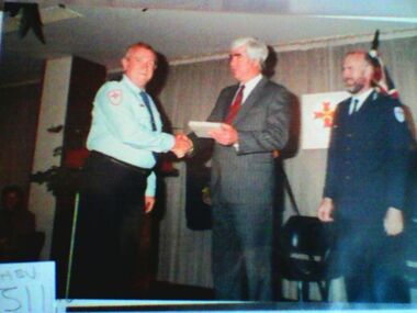 Photograph, award presentation to Chas Martin, 1988 to 1989