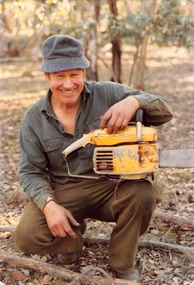 Photograph, Les Sheehan with Chainsaw