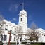 4 images of exterior townhall N, S, E, SE corner garden, white clock tower, portico, garden sculptures