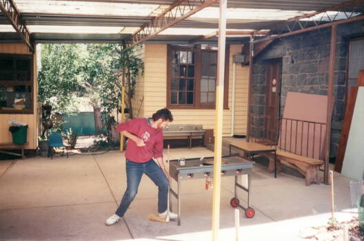 The photograph was taken in the school court yard with two of the weatherboard school rooms visible in the background.  