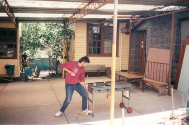 The photograph was taken in the school court yard with two of the weatherboard school rooms visible in the background.  