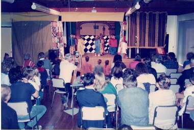 An overview of the audience and hall taken from the rear.
