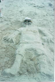 A sand sculpture of a man that the children did on Williamstown Beach.