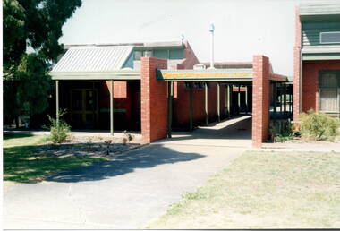A photograph of a modern brick school building