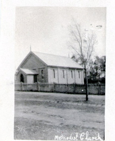 A photograph of a little Church building with the words Methodist Church written across the bottom of the image.