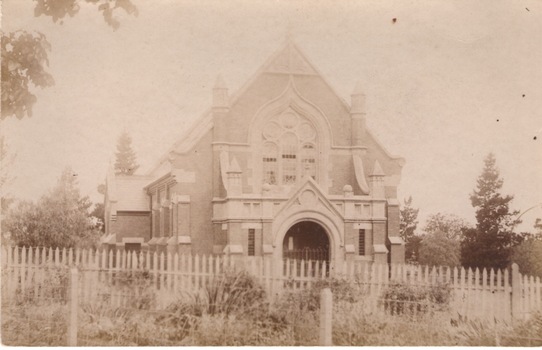 St. Andrew's Presbyterian Church with a picket fence across the front.