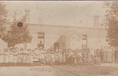 School children standing outside their school building in Macedon Street in Sunbury.