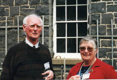 Two guests, a lady and a man, at the opening of the Alister Clark Memorial Rose Garden.