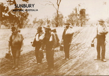 A sepia photograph in post card format of five men awl;king along a dirt road and carrying swags and their billies.