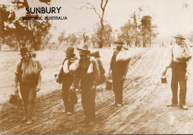 A sepia photograph in post card format of five men awl;king along a dirt road and carrying swags and their billies.