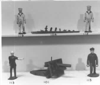 Metal green painted toy mobile artillery gun.