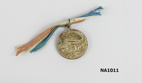 Silver plated medal - Melbourne Centenary 1935 on one side and Centenary of Victoria Portland 1934 on reverse. Red, blue and white ribbon attached.