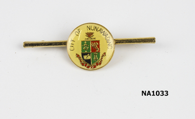 City of Nunawading circular badge set on bar with pin. Badge has Coat of Arms in centre.