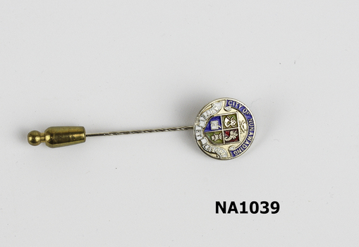 Small circular badge on stick 'City Of Nunawading' in blue and Coat of Arms in centre