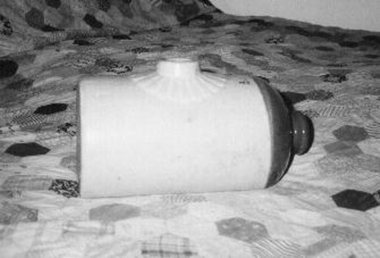 Porcelain cylinder shaped bed warmer 