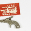 Toy silver metal gun with movable hammer for caps. 