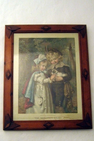 Ornate wooden frame of picture depicting boy and girl in period costume 