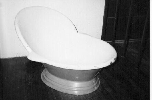 Metal hip bath painted cream inside and light brown on outside. 