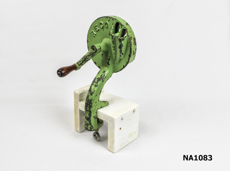 Green painted metal bean cutter. 