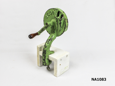 Green painted metal bean cutter. 