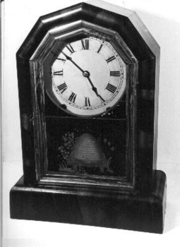  Standing pendulum clock with painted beehive decoration below clock face.