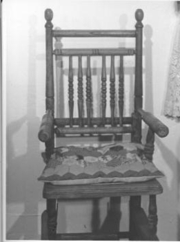 Wooden high chair on wheels