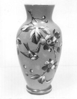 Two vases with grey background and blue pattern of birds, leaves and flowers