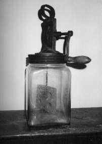  Solid square glass jar with metal top and gear wheel