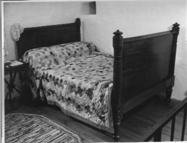 Wooden double bed.