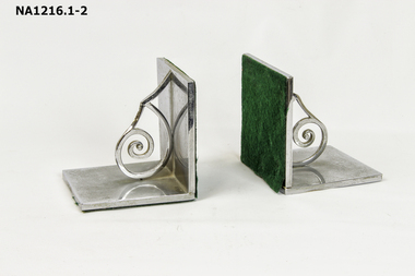 A pair of decorative silver metal Book Ends