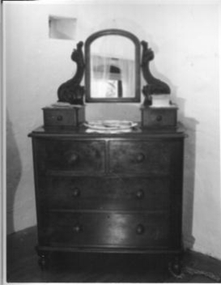 Mahogney dressing table with six drawers.