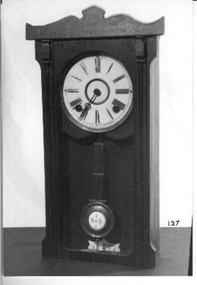 Dark wooden mantel clock