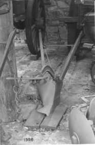 Horse drawn single farrow mouldboard plough - wooden handles.