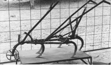 Lever tyned walking scarifier, pulled by a horse. 