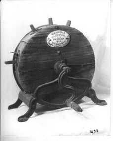  Wooden round container on metal legs with a metal handle to turn it with. 