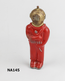 Red Celluloid Diver with Gold painted helmet with silver face grille. 