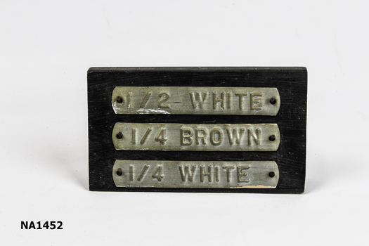 Wooden free standing sign with 6 nails to support 3 embossed metal tags