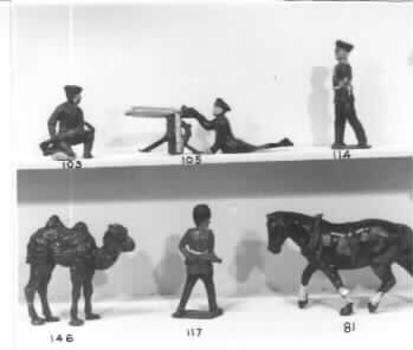 Brown painted metal camel with two humps.
