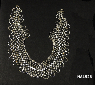 Collar formed entirely of white and clear beading