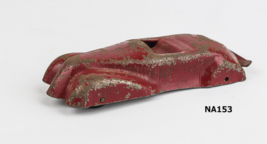 Red painted metal sports car.