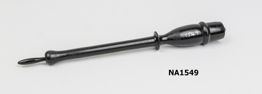 Long black ebony 'baton' shaped instrument 