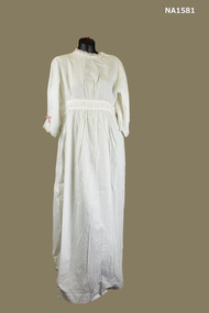 White cotton Nightdress with round neckline and long sleeves. 