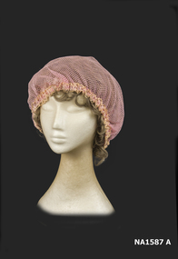 Pinl net Boudoir Cap with tinsel lace at edge.