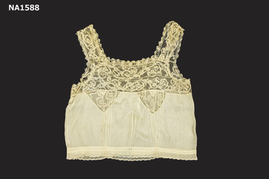 Cream silk camisole with square neckline.