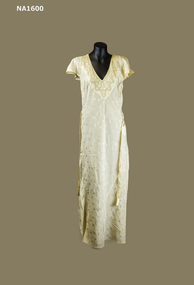 Cream Fuji silk nightdress with flower pattern in the material.  Applique embroidery on V neck and cap sleeves.