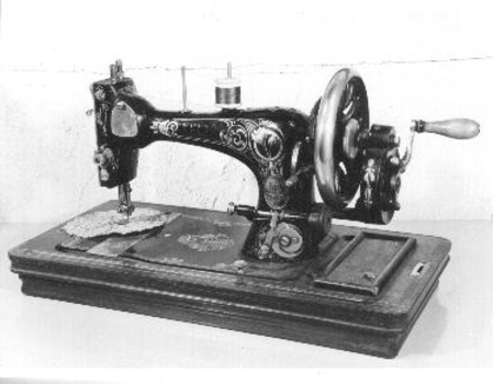 Black sewing machine and cover.