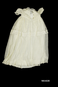 Cream christening gown with silk underskirt. 