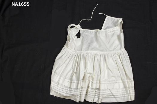 White cotton petticoat with pin-tucking at hem.